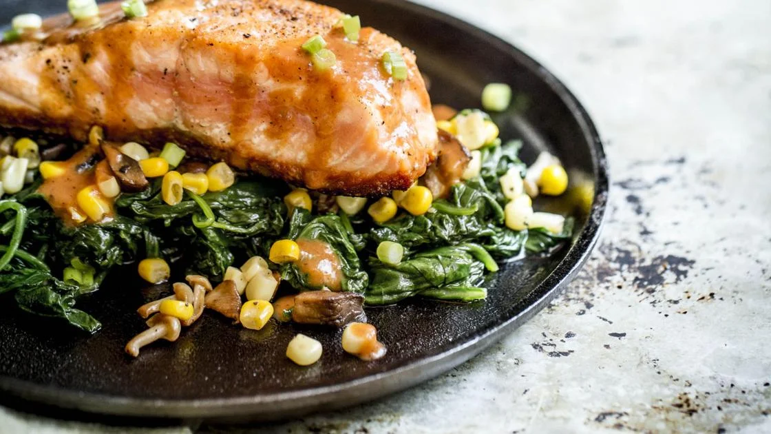 Salmon with mustard green and succotash