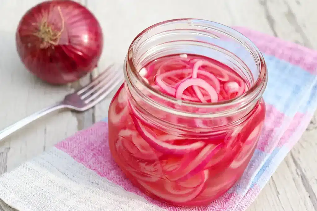Pickled Onion In Jar Placed With Onion