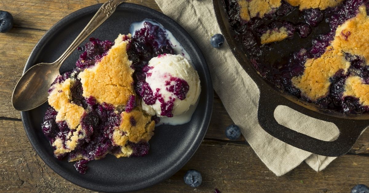 Blueberry Cobbler Served In Plate With Spoon