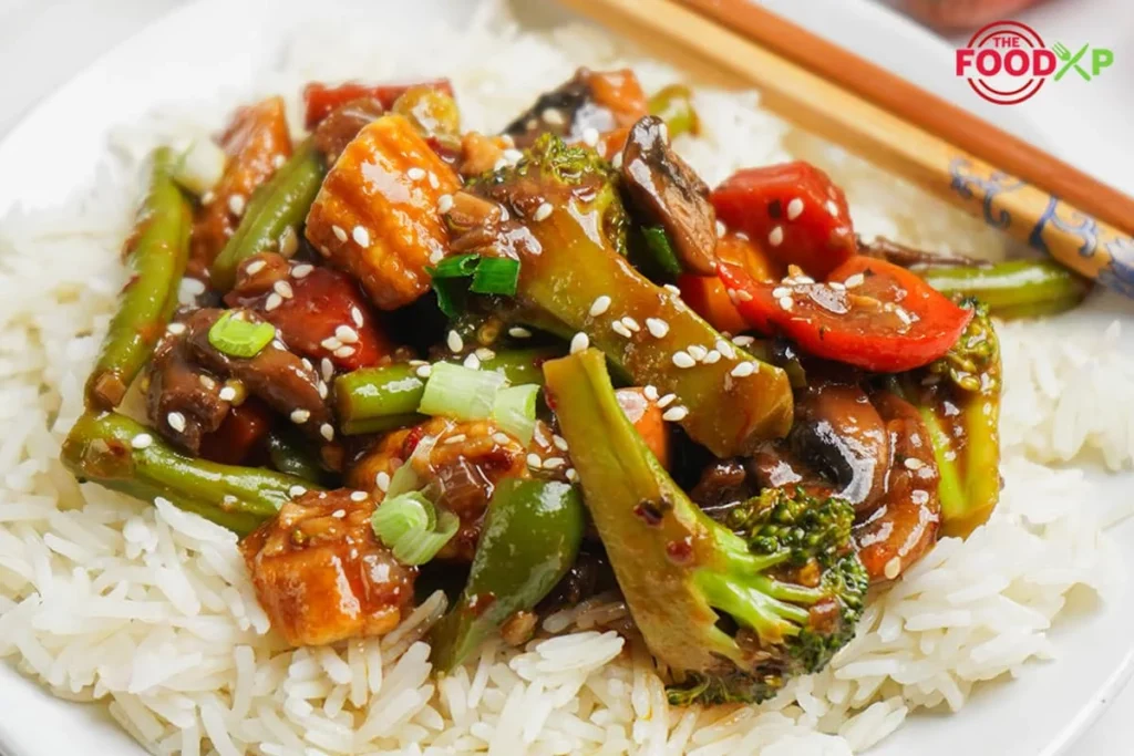 Serving-Schezwan-Vegetables